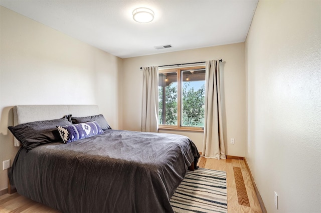10 Carlito Rd, Santa Fe, NM 87508 - bedroom with light wood-style floors and baseboards