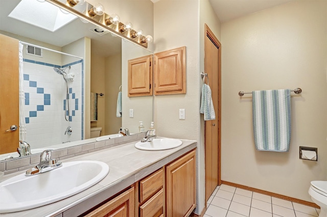 10 Carlito Rd, Santa Fe, NM 87508 - full bath with a skylight, double vanity, tile patterned floors, and bathing tub / shower combination
