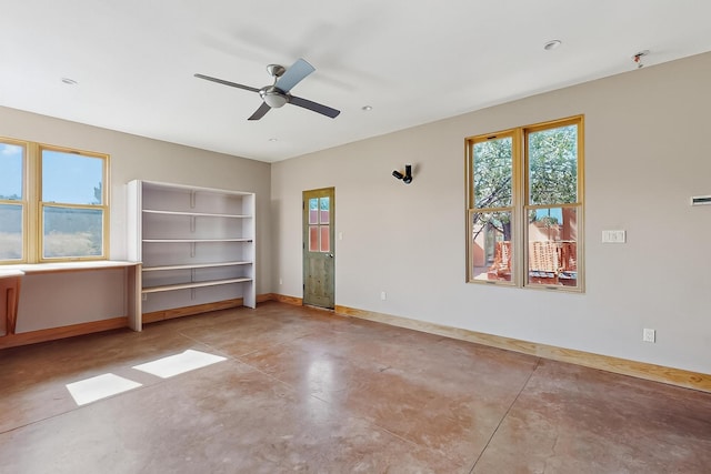 37 Camino Tetzcoco, Santa Fe, NM 87508 - unfurnished bedroom featuring concrete floors and ceiling fan