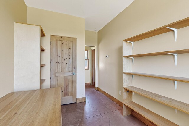 37 Camino Tetzcoco, Santa Fe, NM 87508 - hall featuring finished concrete floors and baseboards