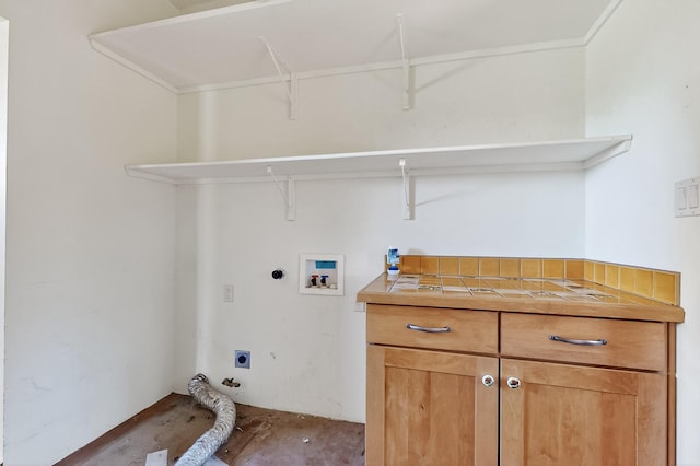 37 Camino Tetzcoco, Santa Fe, NM 87508 - washroom with hookup for an electric dryer, hookup for a washing machine, and cabinet space
