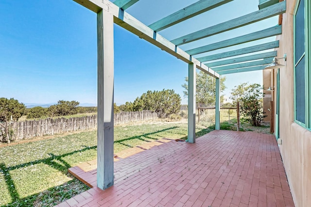 37 Camino Tetzcoco, Santa Fe, NM 87508 - fenced backyard with a pergola and a patio area