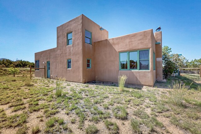 37 Camino Tetzcoco, Santa Fe, NM 87508 - rear view of property with stucco siding