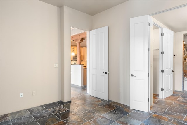 1405 Vegas Verdes Unit 136, Santa Fe, NM 87507 - empty room with stone tile floors