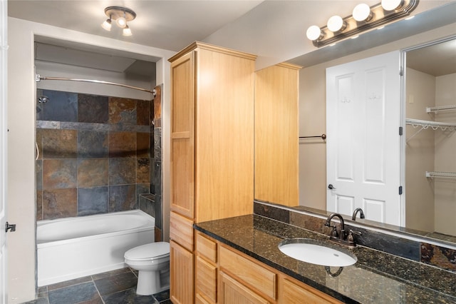 1405 Vegas Verdes Unit 136, Santa Fe, NM 87507 - bathroom featuring vanity, shower / washtub combination, and stone tile floors