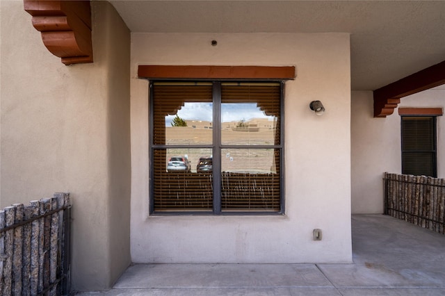 1405 Vegas Verdes Unit 136, Santa Fe, NM 87507 - doorway to property featuring stucco siding