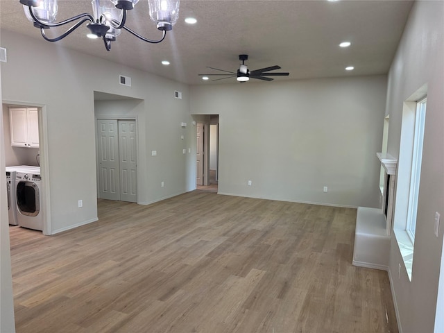 7512 Sagebrush, Santa Fe, NM 87507 - unfurnished living room with a chandelier, ceiling fan, recessed lighting, light wood-style floors, and washing machine and dryer