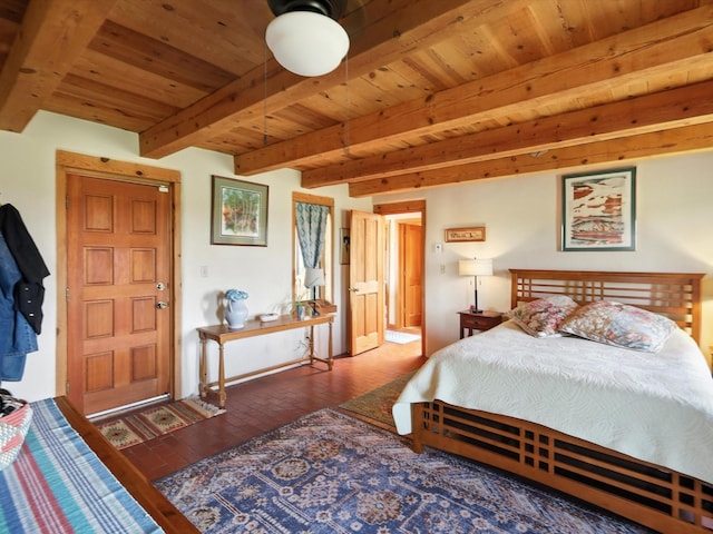 62 Camerada Loop, Santa Fe, NM 87508 - bedroom featuring a wood ceiling with exposed beams and brick flooring