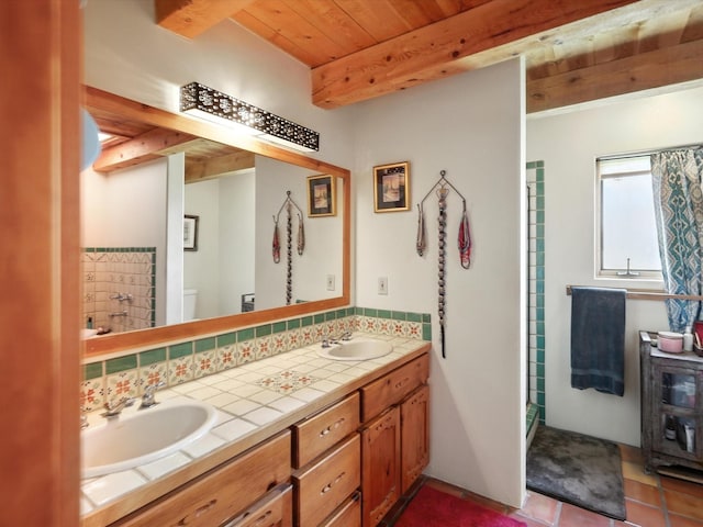 62 Camerada Loop, Santa Fe, NM 87508 - bathroom with backsplash, double vanity, a wooden ceiling with exposed beams, and tile patterned floors