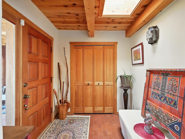 62 Camerada Loop, Santa Fe, NM 87508 - entrance foyer with a wood ceiling with exposed beams and brick floors