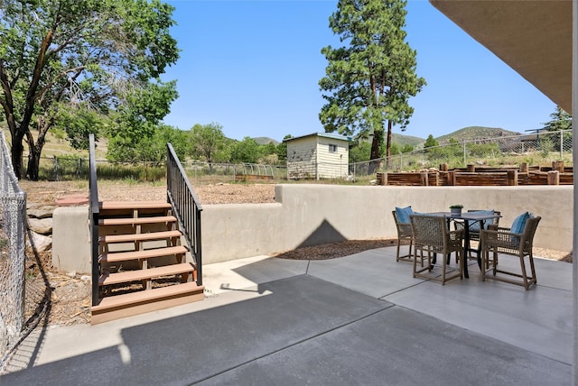 4857 Yucca St, Los Alamos, NM 87544 - view of patio / terrace with a mountain view, outdoor dining space, and stairs