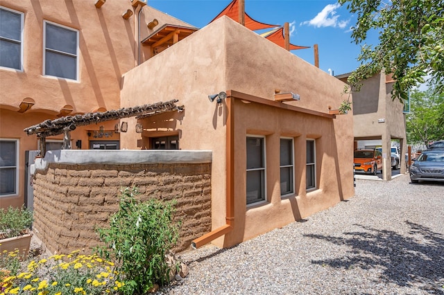 815 Baca Unit C, Santa Fe, NM 87505 - rear view of house featuring stucco siding
