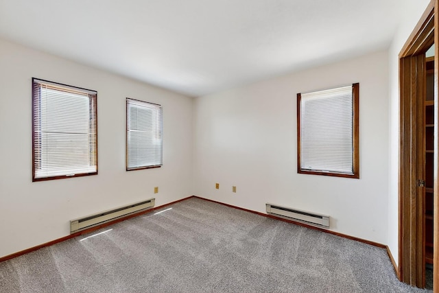 2600 Zia Unit C6, Santa Fe, NM 87505 - unfurnished bedroom with a baseboard heating unit and carpet