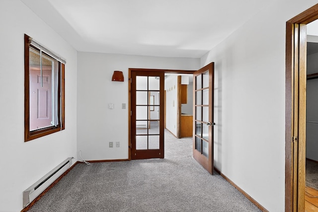 2600 Zia Unit C6, Santa Fe, NM 87505 - unfurnished room featuring french doors, a baseboard radiator, and carpet