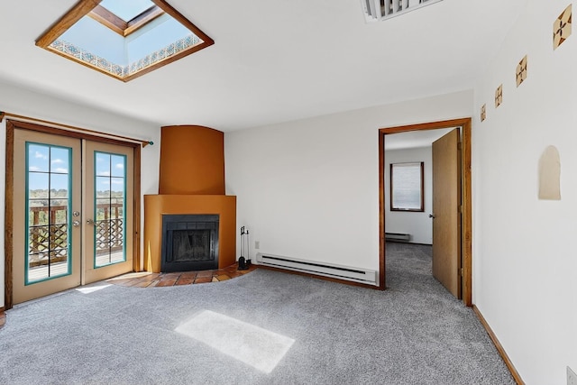 2600 Zia Unit C6, Santa Fe, NM 87505 - unfurnished living room featuring a baseboard heating unit, carpet floors, a skylight, and a fireplace