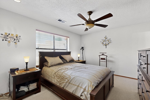 7507 Kachina Loop, Santa Fe, NM 87507 - bedroom featuring light carpet, a textured ceiling, and ceiling fan