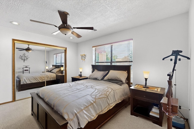 7507 Kachina Loop, Santa Fe, NM 87507 - bedroom with carpet flooring, a textured ceiling, a closet, ceiling fan, and recessed lighting