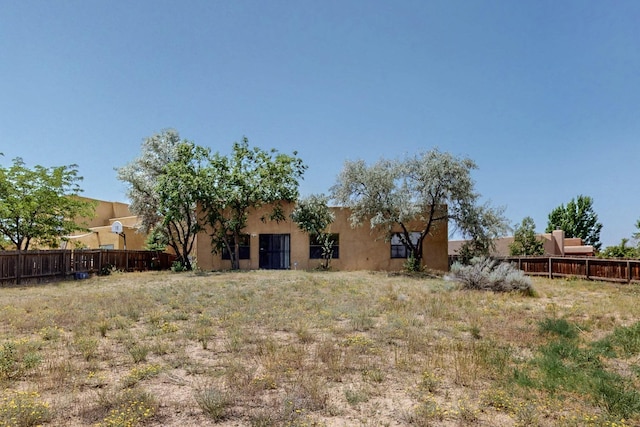 7507 Kachina Loop, Santa Fe, NM 87507 - rear view of property featuring stucco siding
