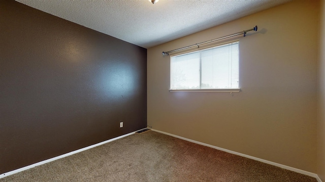 3055 Trinity Dr Unit 517, Los Alamos, NM 87544 - carpeted empty room featuring baseboards and a textured ceiling