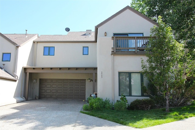 5045 Carriage House Dr, Los Alamos, NM 87544 - view of front of house featuring a balcony, stucco siding, concrete driveway, and a garage