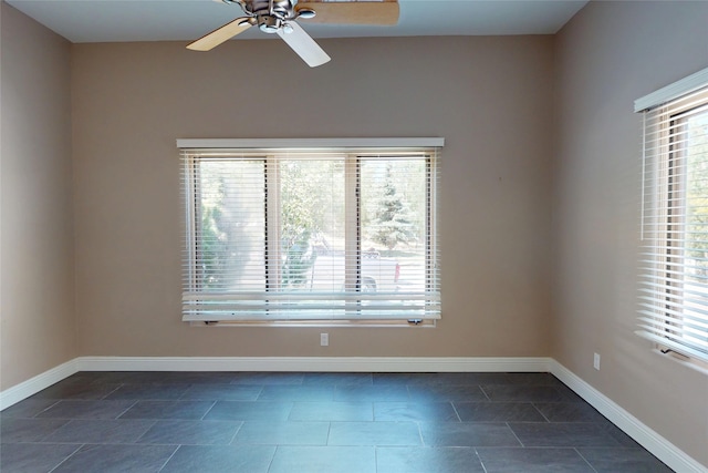5045 Carriage House Dr, Los Alamos, NM 87544 - empty room featuring ceiling fan and dark tile patterned flooring