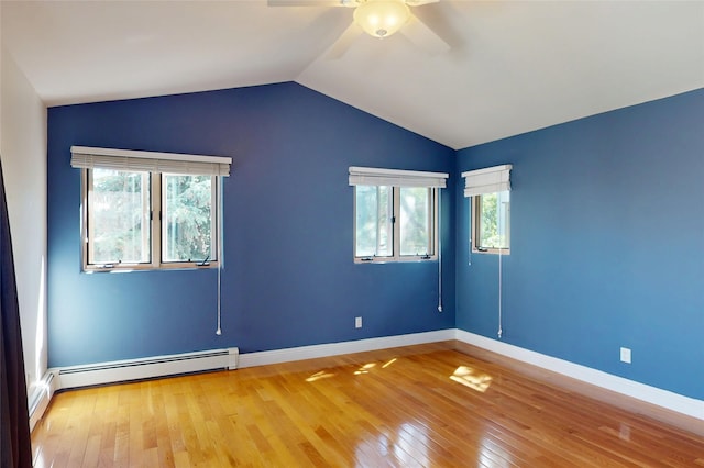 5045 Carriage House Dr, Los Alamos, NM 87544 - spare room with a ceiling fan, light wood finished floors, a baseboard heating unit, and vaulted ceiling
