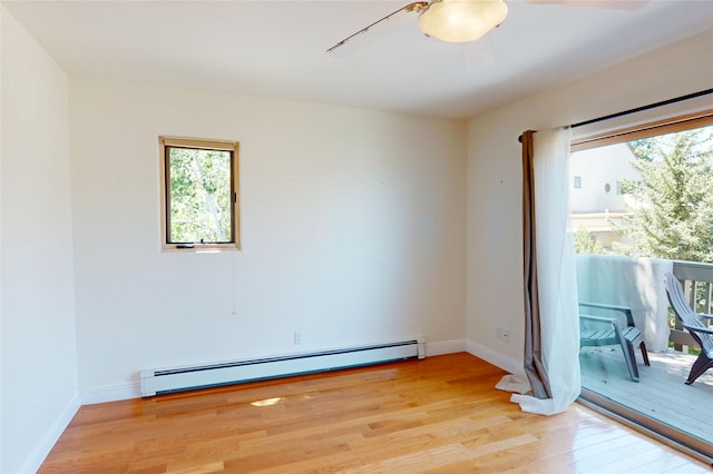 5045 Carriage House Dr, Los Alamos, NM 87544 - empty room with baseboard heating, light wood finished floors, and a ceiling fan