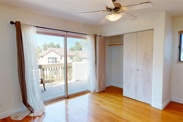 5045 Carriage House Dr, Los Alamos, NM 87544 - unfurnished bedroom featuring access to outside, light wood-style flooring, a closet, and a ceiling fan