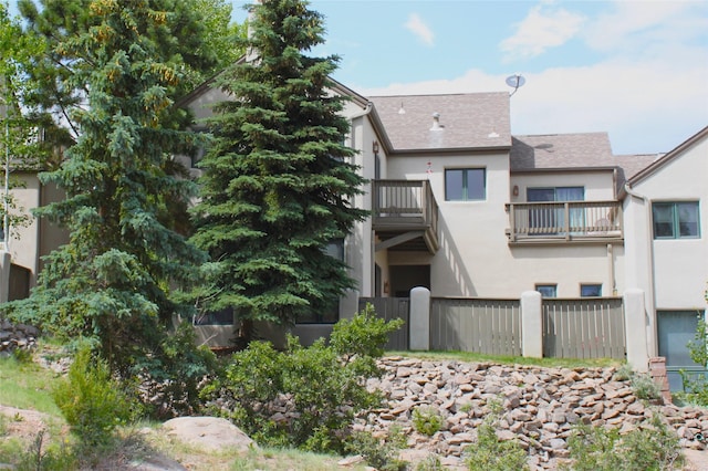 5045 Carriage House Dr, Los Alamos, NM 87544 - back of property featuring stucco siding and a shingled roof
