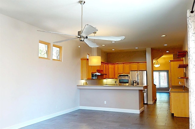 5045 Carriage House Dr, Los Alamos, NM 87544 - kitchen with appliances with stainless steel finishes, ceiling fan, a peninsula, recessed lighting, and light countertops