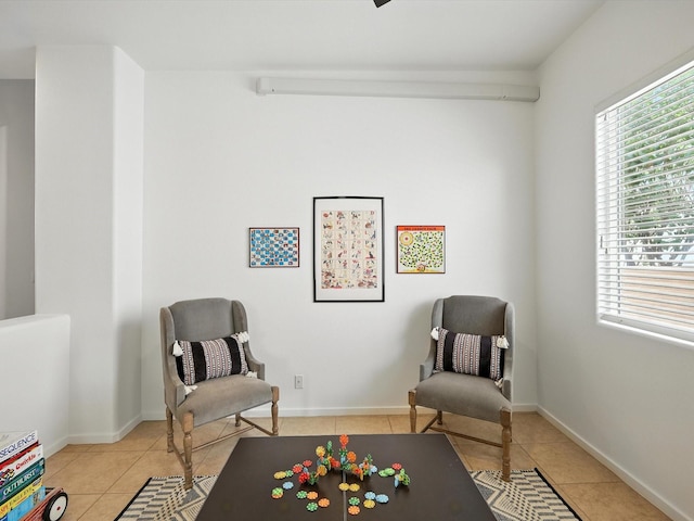 16 Coyote Pass Rd, Santa Fe, NM 87508 - sitting room featuring light tile patterned floors and plenty of natural light
