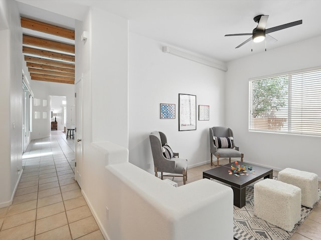 16 Coyote Pass Rd, Santa Fe, NM 87508 - sitting room featuring light tile patterned floors, ceiling fan, and beamed ceiling