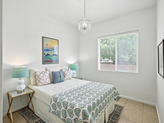 16 Coyote Pass Rd, Santa Fe, NM 87508 - tiled bedroom with baseboards and a chandelier