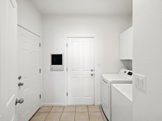 16 Coyote Pass Rd, Santa Fe, NM 87508 - laundry area featuring washer and dryer, light tile patterned floors, and cabinet space