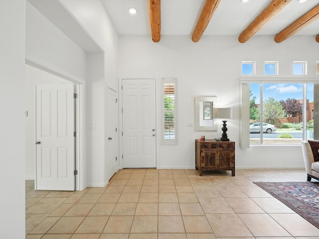 16 Coyote Pass Rd, Santa Fe, NM 87508 - foyer featuring light tile patterned floors, beam ceiling, and recessed lighting