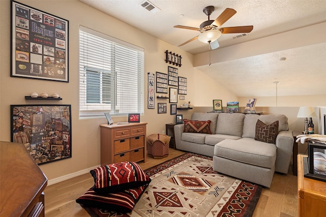 4351 San Benito Unit A, Santa Fe, NM 87507 - living area featuring wood finished floors, a ceiling fan, and a textured ceiling