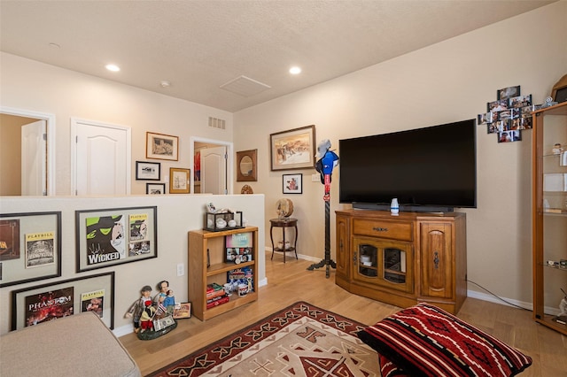 4351 San Benito Unit A, Santa Fe, NM 87507 - living area featuring wood finished floors and recessed lighting