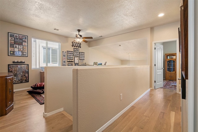 4351 San Benito Unit A, Santa Fe, NM 87507 - hall with light wood-type flooring and a textured ceiling