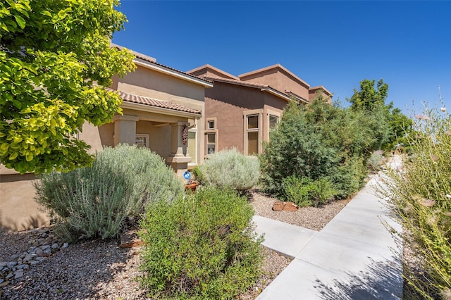 4351 San Benito Unit A, Santa Fe, NM 87507 - view of front of house featuring stucco siding and a tile roof
