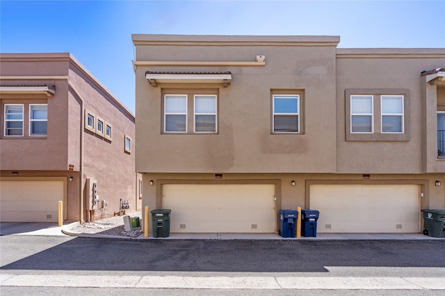 4351 San Benito Unit A, Santa Fe, NM 87507 - view of front of house with stucco siding and a garage
