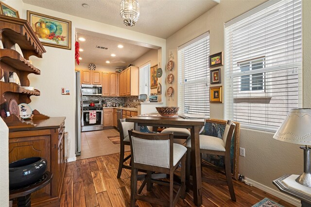 4351 San Benito Unit A, Santa Fe, NM 87507 - dining area with light wood-style floors and recessed lighting