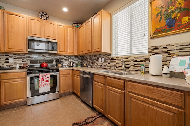 4351 San Benito Unit A, Santa Fe, NM 87507 - kitchen with stainless steel appliances, backsplash, light countertops, light tile patterned floors, and recessed lighting