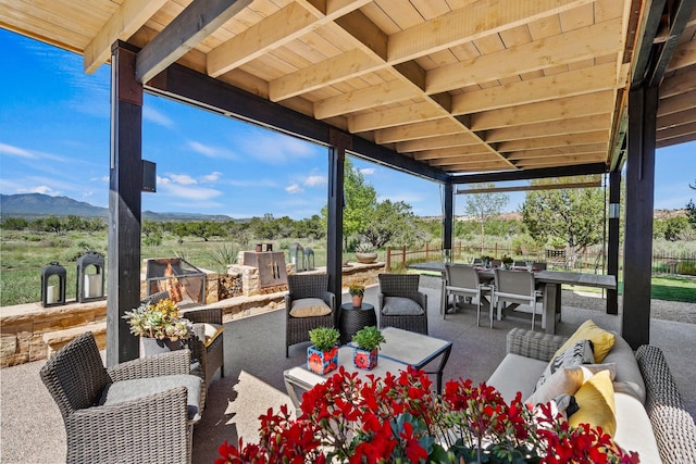 24 Whispering Spirits Dr, Cerrillos, NM 87010 - view of patio with outdoor dining area, outdoor lounge area, and a mountain view