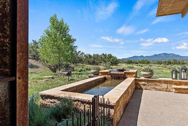 24 Whispering Spirits Dr, Cerrillos, NM 87010 - view of patio with a mountain view