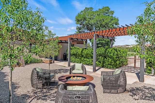 24 Whispering Spirits Dr, Cerrillos, NM 87010 - view of patio with an outdoor fire pit and a pergola