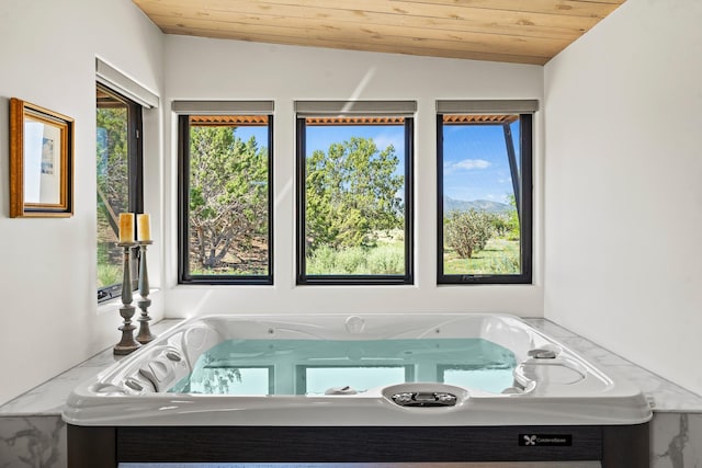 24 Whispering Spirits Dr, Cerrillos, NM 87010 - full bath with wood ceiling, healthy amount of natural light, and vaulted ceiling