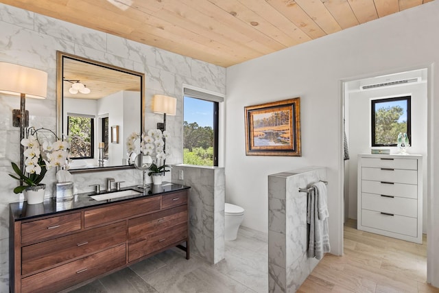 24 Whispering Spirits Dr, Cerrillos, NM 87010 - bathroom featuring wooden ceiling, vanity, and tile walls