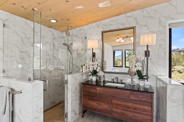 24 Whispering Spirits Dr, Cerrillos, NM 87010 - full bath with tile walls, vanity, healthy amount of natural light, wooden ceiling, and a marble finish shower