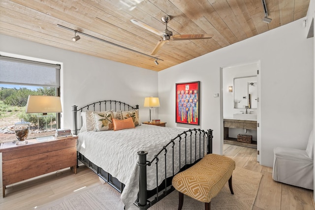 24 Whispering Spirits Dr, Cerrillos, NM 87010 - bedroom featuring track lighting, wood ceiling, vaulted ceiling, light wood finished floors, and ensuite bath