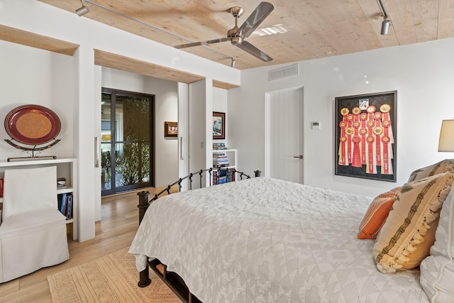 24 Whispering Spirits Dr, Cerrillos, NM 87010 - bedroom with wood finished floors, wood ceiling, and a ceiling fan